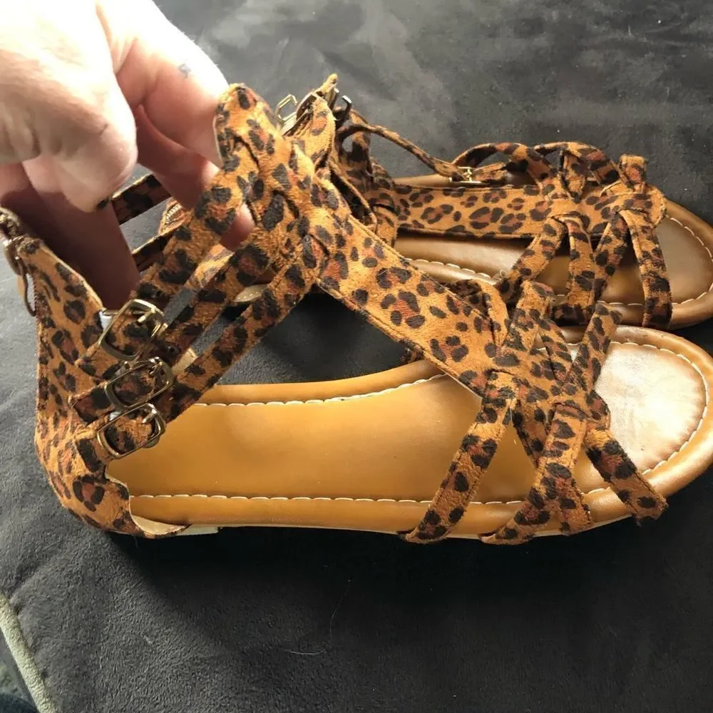 New never worn animal print buckle sandals. Side clasps . Zipper up the back.